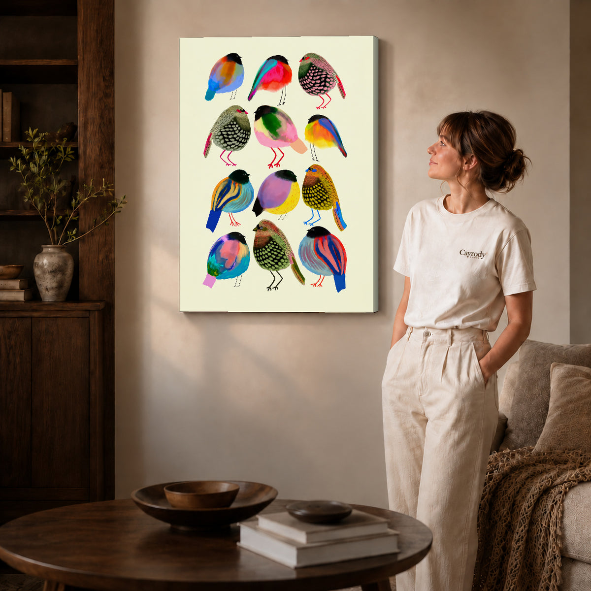 Colorful birds canvas art on unframed wrapped canvas, showing natural edge depth against the living room wall.