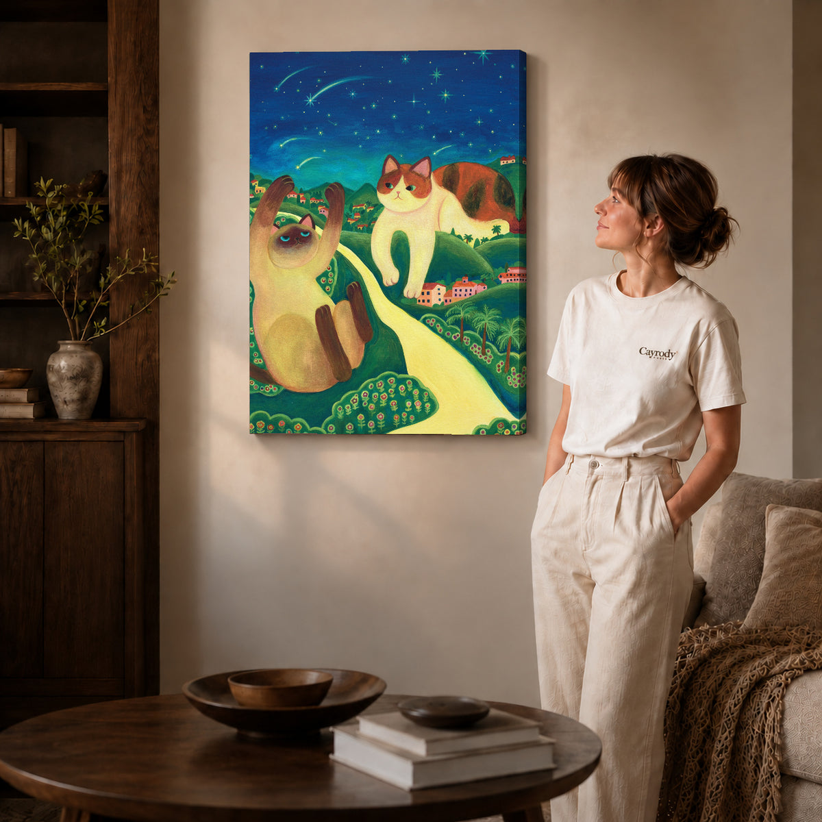 Starry cats canvas art on unframed wrapped canvas, showing natural edge depth against the living room wall.