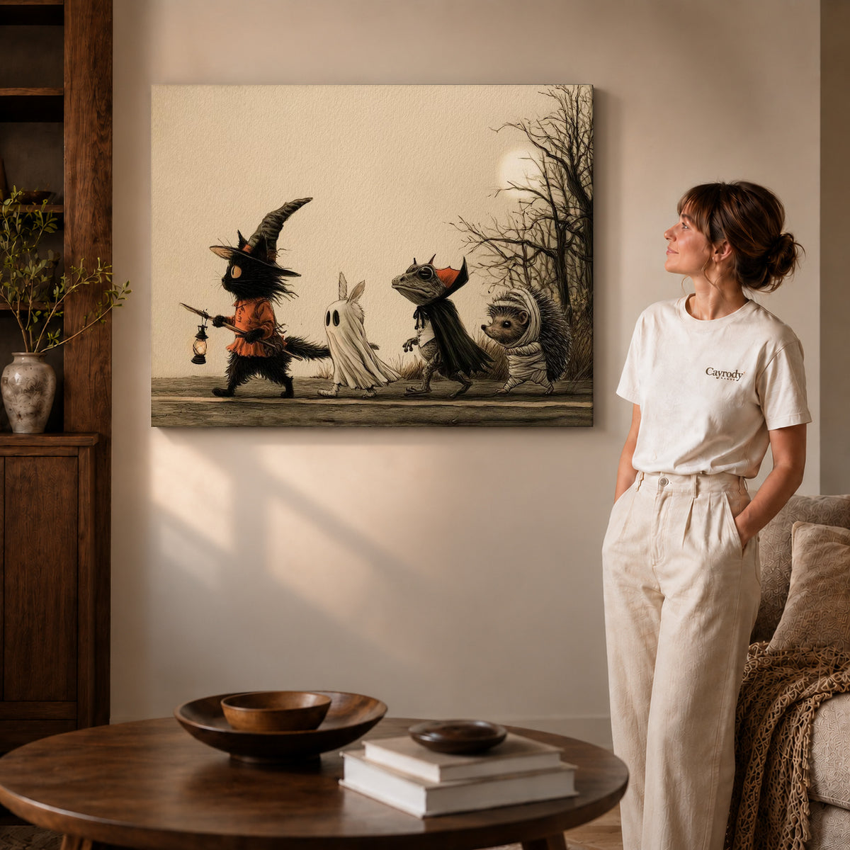 Gallery wrapped halloween parade canvas art with visible canvas edges beside a standing woman.