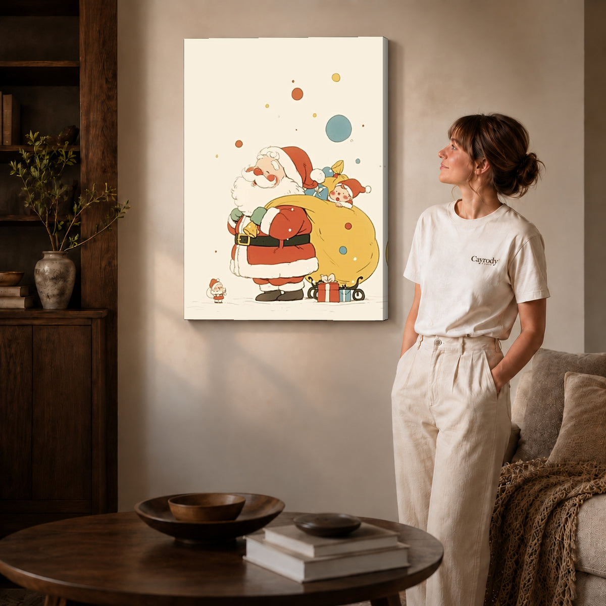 Gallery wrapped little santa canvas art with visible canvas edges beside a standing woman.