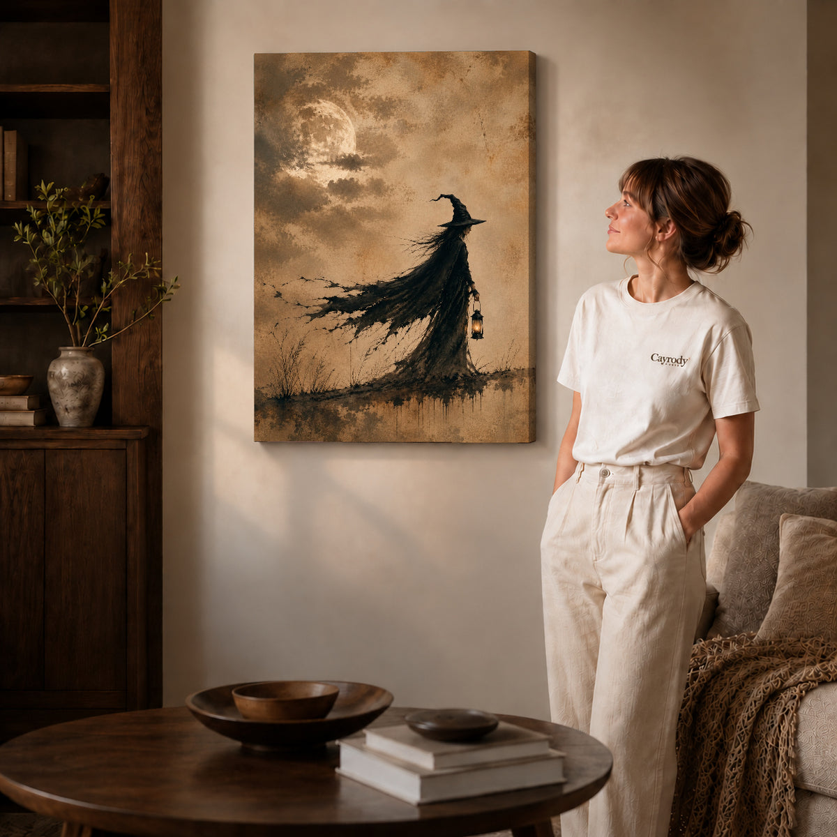 Gallery wrapped lantern witch canvas art with visible canvas edges beside a standing woman.