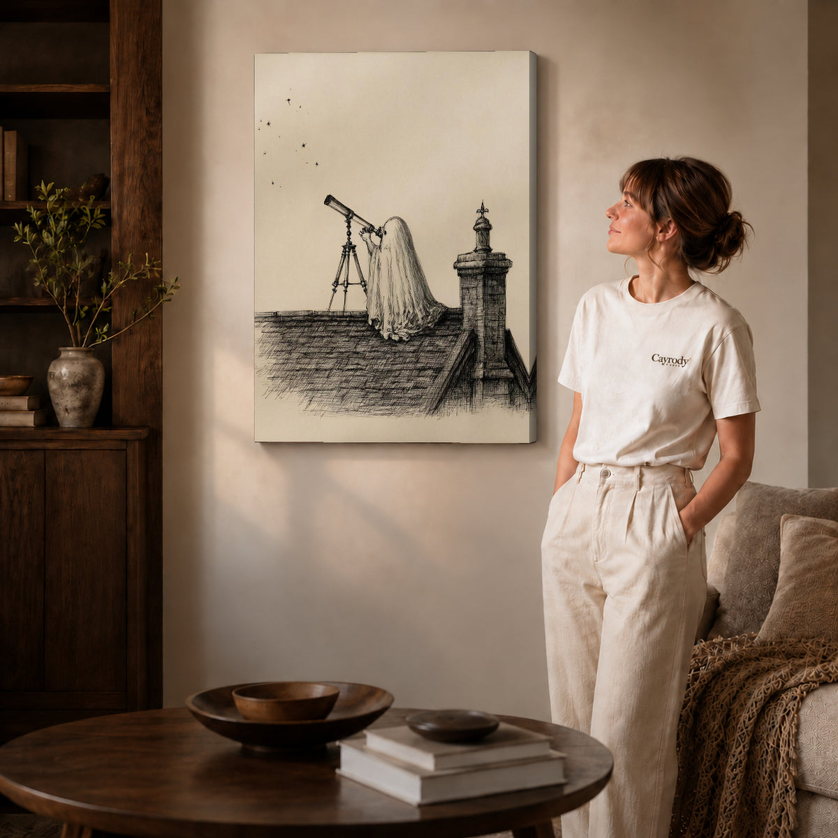 Gallery wrapped stargazing ghost canvas art with visible canvas edges beside a standing woman.