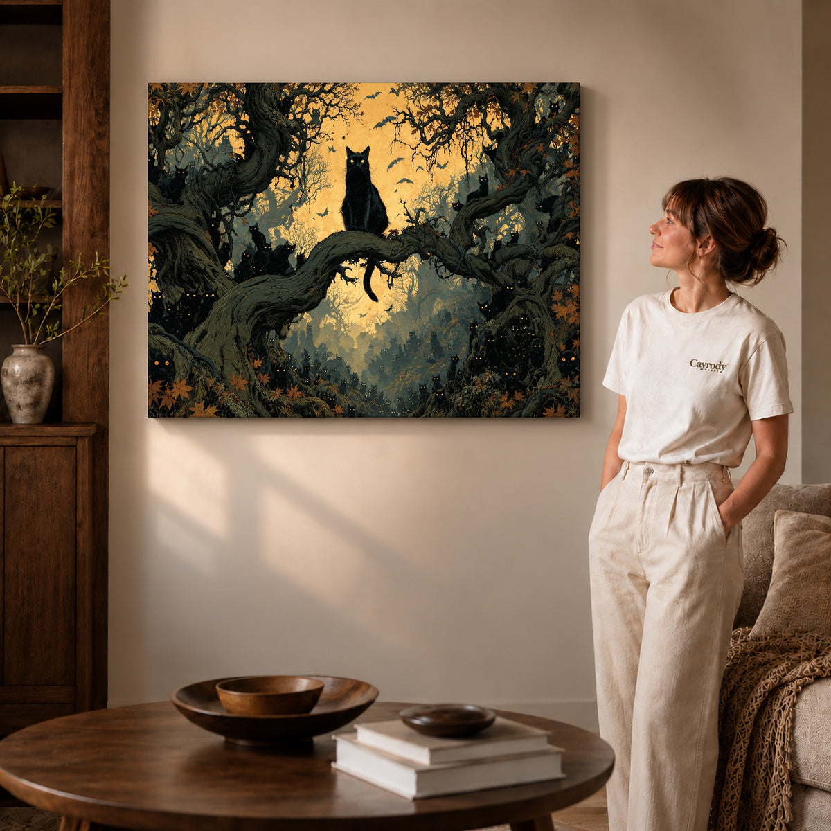 Gallery wrapped enchanted cat forest canvas art with visible canvas edges beside a standing woman.