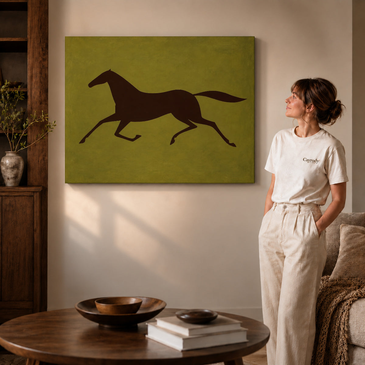 Gallery wrapped galloping horse canvas art with visible canvas edges beside a standing woman.