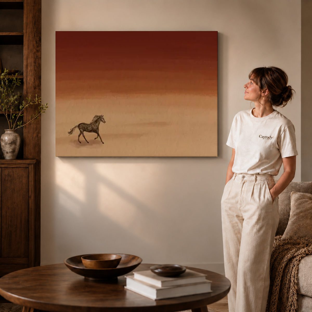Gallery wrapped desert horse canvas art with visible canvas edges beside a standing woman.