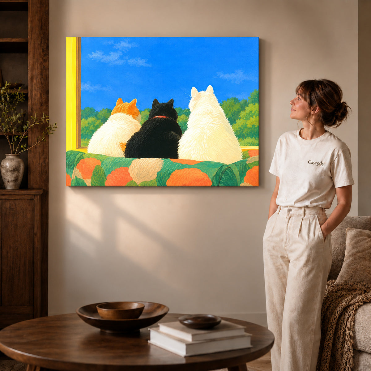 Gallery wrapped window cats canvas art showing dimensional edges and soft shadows in a living room.