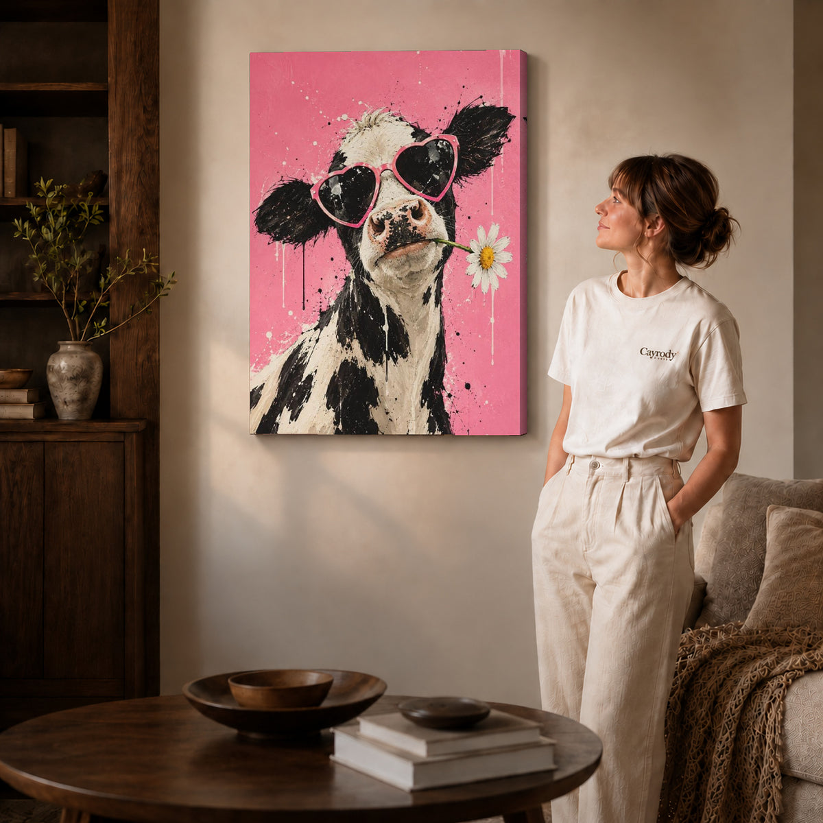 Gallery wrapped funny cow canvas art showing dimensional edges and soft shadows in a living room.