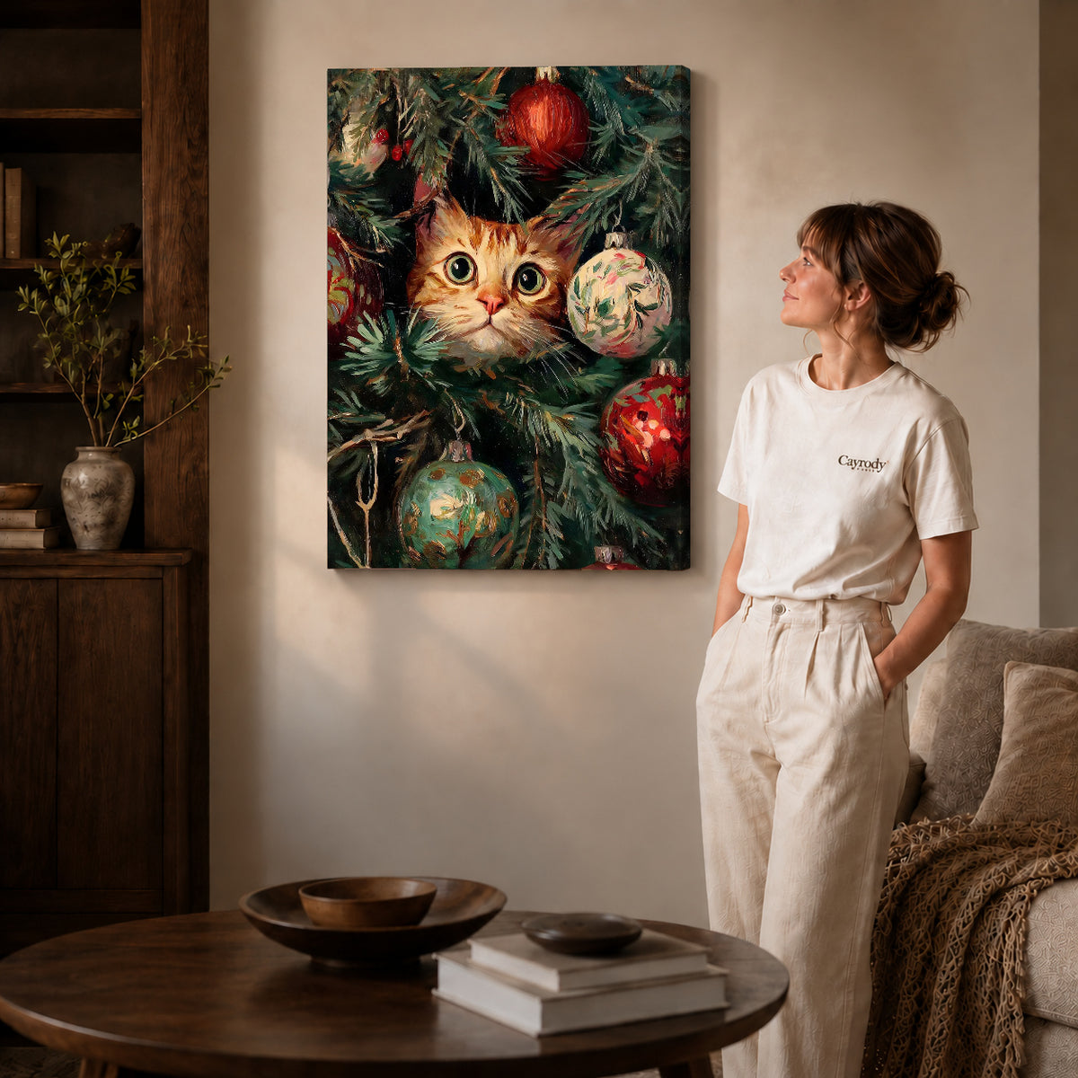Gallery wrapped christmas kitten canvas art showing dimensional edges and soft shadows in a living room.