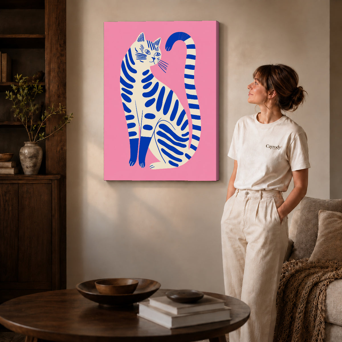 Striped cat canvas art shown in the gallery-wrapped option with visible depth and warm surroundings.