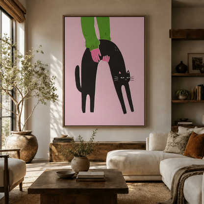 Bold funny cat illustration hanging on wall in a sunlit boho living room with white sofa