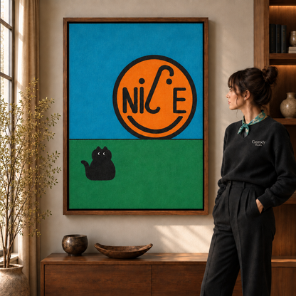 Woman in a black sweater viewing a framed orange NICE smiley and black cat artwork in a warm living room.