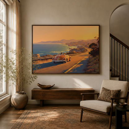 Framed retro coastal road trip canvas wall art above a wood console in a warm neutral entryway with arched staircase