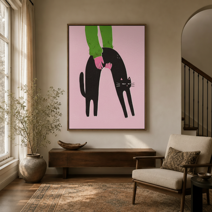 Quirky black cat canvas wall art displayed above a wooden console in a warm neutral entryway