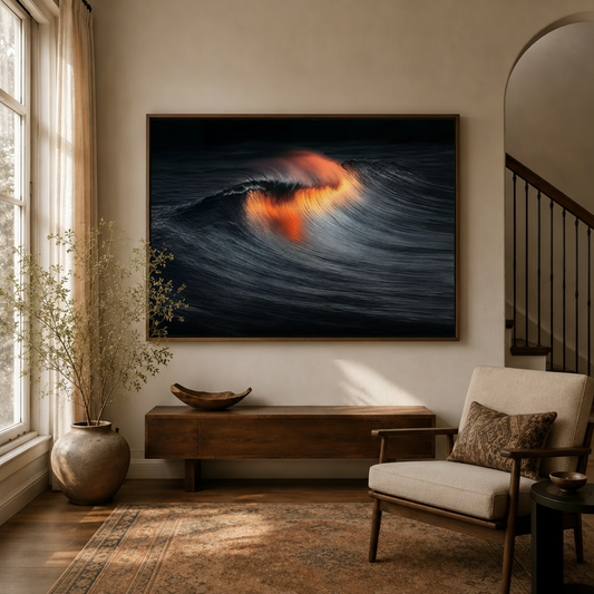 Dark ocean wave canvas wall art with fire glow displayed above console in warm neutral entryway