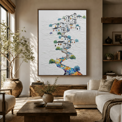 Colorful village path impasto canvas print displayed in a warm neutral living room above a white sofa