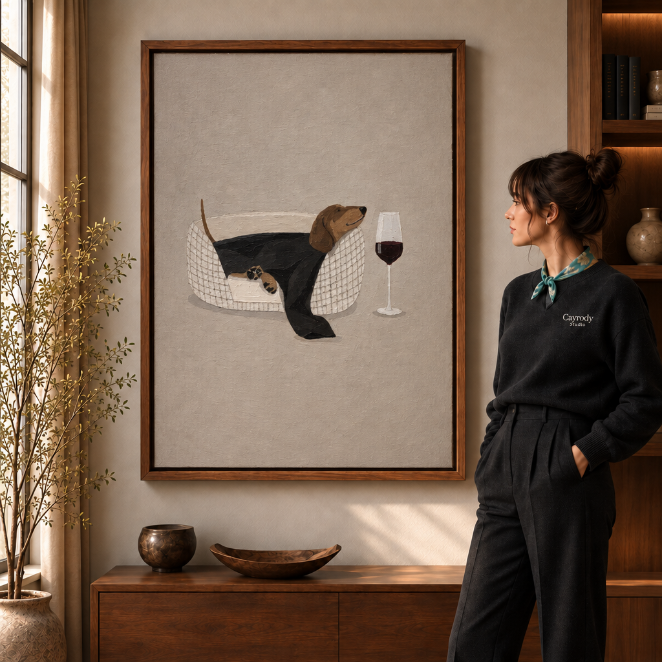 Whimsical black cat canvas wall art with blue-and-white teacups beside a woman in a warm living room.