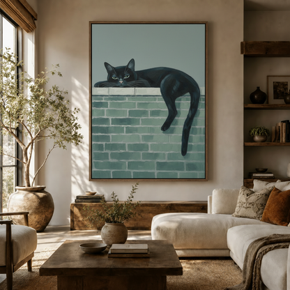 Black cat on teal brick wall canvas print displayed in warm modern living room above wooden sideboard