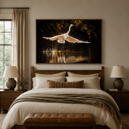 Dramatic egret taking flight golden backlight canvas wall art in walnut float frame above neutral bedroom headboard