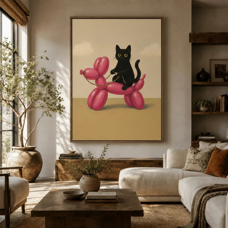 Whimsical black cat balloon dog framed canvas art hanging in a sunlit boho living room