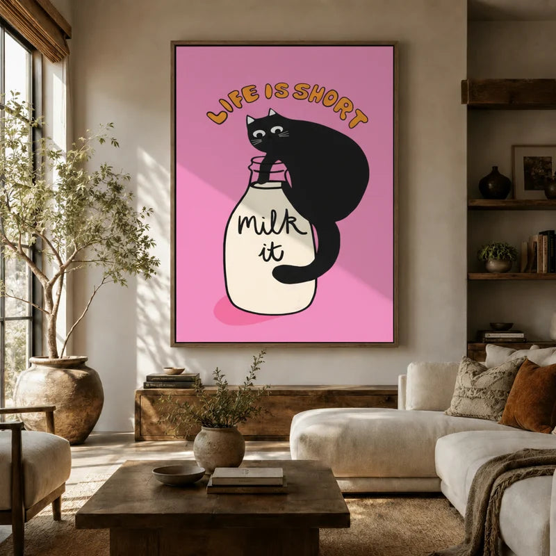 Bold pink black cat canvas wall art hung above a sofa in a warm boho living room with earthy tones