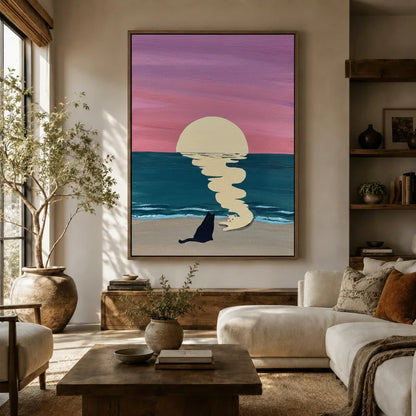 Romantic sunset beach cat wall art hung above a sofa in a cozy boho living room with earthy tones and plants