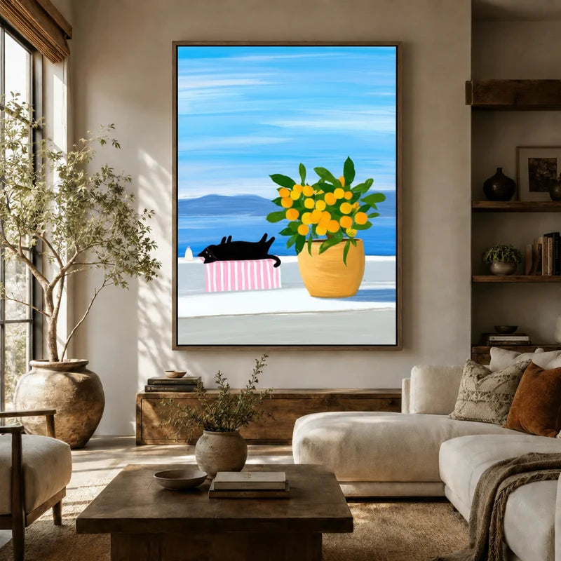 Coastal cat and lemon tree wall art in a cozy living room with natural light and linen armchair