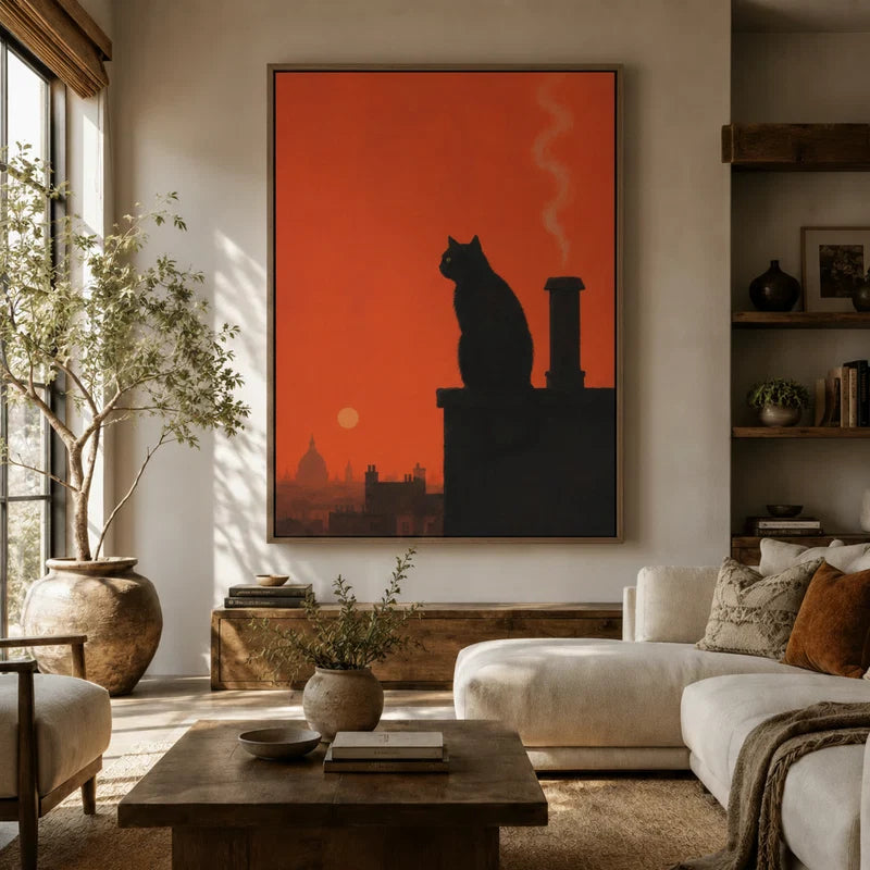Moody black cat sunset silhouette framed canvas hanging above a sofa in a boho-organic living room