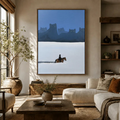 Oversized surreal western cat canvas in floater frame above a white sofa in a sunlit organic modern living room