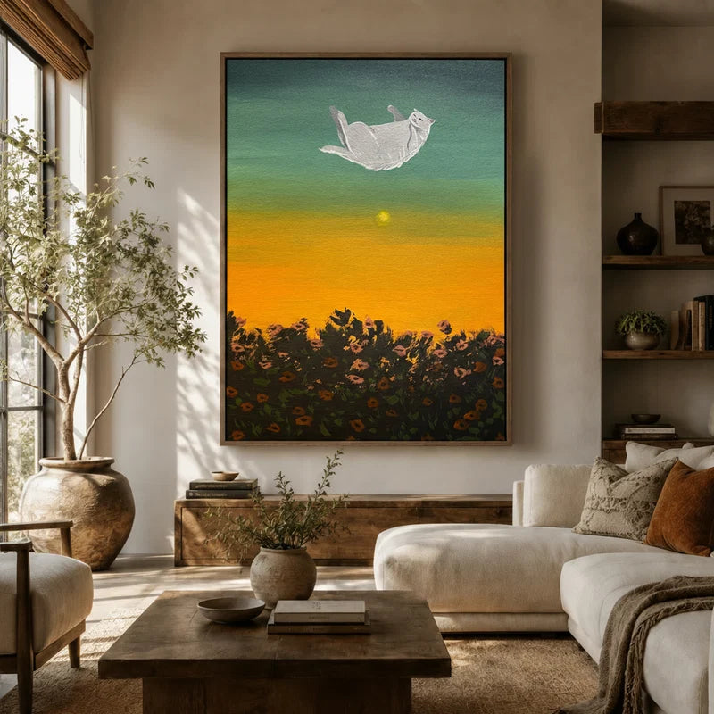 Surreal white cat floating over wildflower field wall art in a cozy living room with natural light