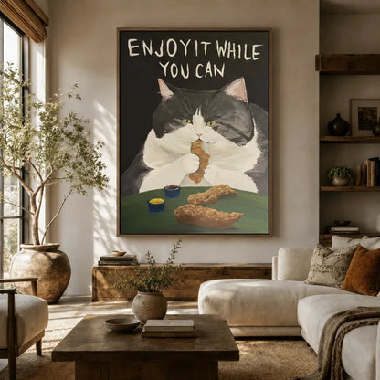 Dark humor cat canvas wall art hung above a sofa in a cozy boho living room with earthy tones
