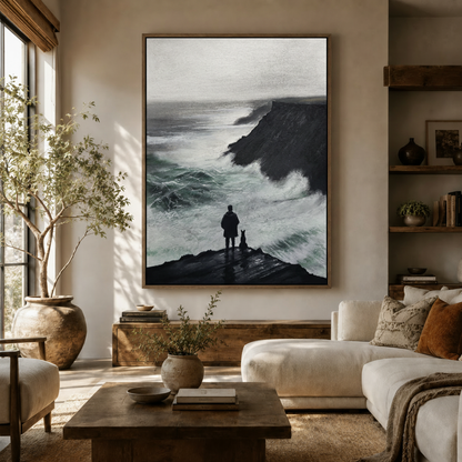Stormy cliffside oil painting of man and dog displayed in modern living room above sofa