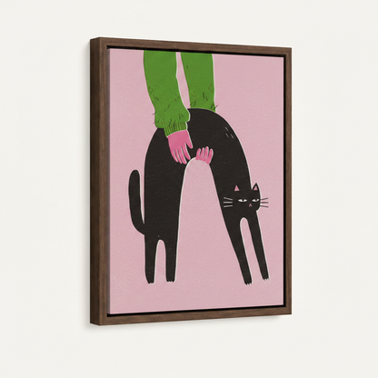Framed canvas close-up showing arching black cat on pink with walnut wood frame detail