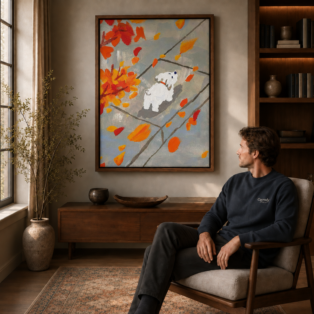 Man seated in a modern lounge admiring a fall leaves puppy canvas in a deep walnut frame, natural window light.