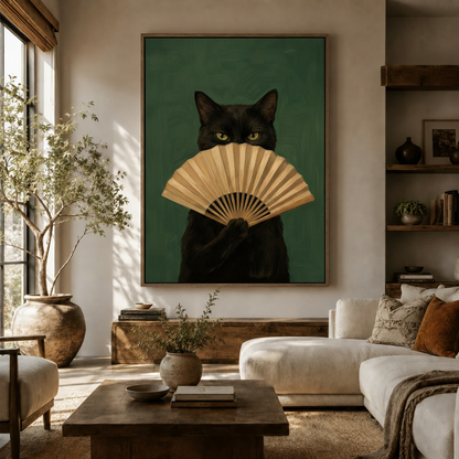 Black cat with folding fan portrait canvas hung above white sofa in bright modern living room
