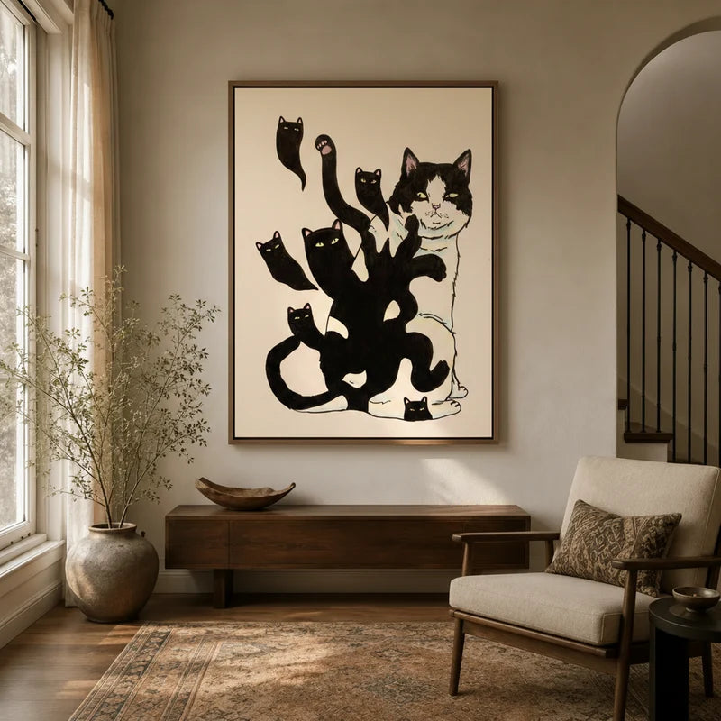 Minimalist tuxedo cat shadow canvas in floater frame displayed in warm neutral entryway with wood console and armchair