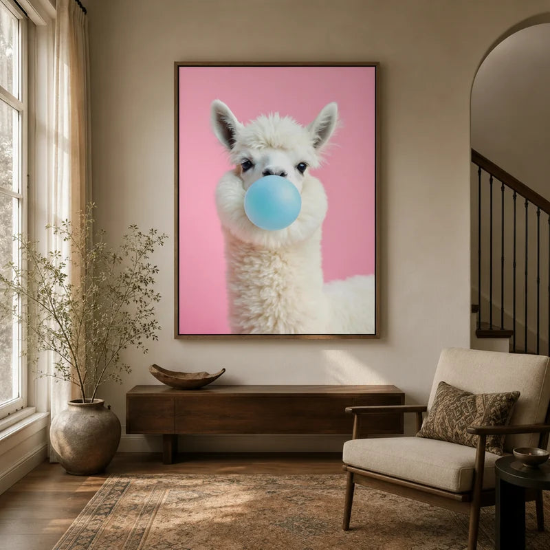 Framed funny alpaca blowing blue bubble gum canvas wall art in warm neutral entryway with arched doorway