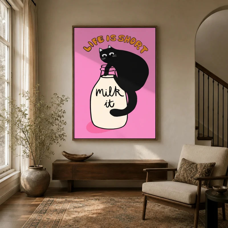 Framed black cat retro poster canvas wall art displayed in a bright neutral entryway with wood console