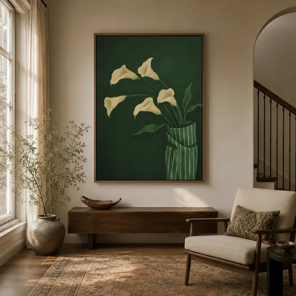 Calla lily botanical canvas art in walnut float frame displayed in a warm neutral entryway with wood console and arched staircase