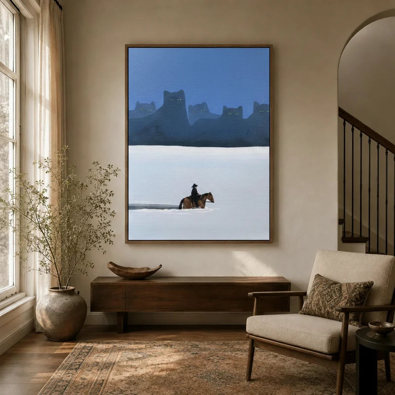 Large framed cowboy cat surreal canvas wall art hung above a console table in a warm neutral entryway
