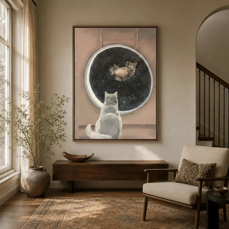 Celestial cat canvas wall art displayed above a console table in a warm neutral entryway
