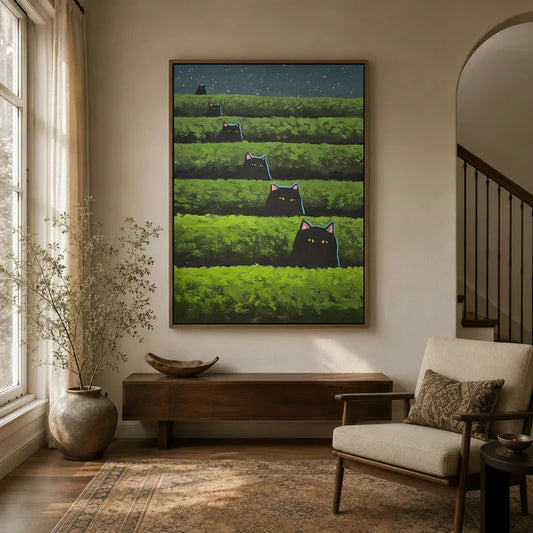 Whimsical black cat canvas wall art hanging in a warm neutral entryway above a wooden console