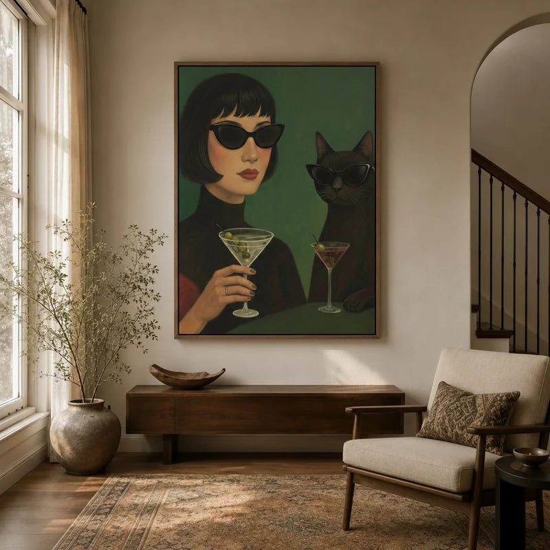 Retro woman and black cat martini wall art in walnut floater frame, displayed in warm neutral entryway