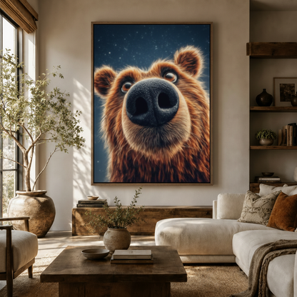 Oversized whimsical bear portrait canvas print displayed above a sofa in a bright boho living room