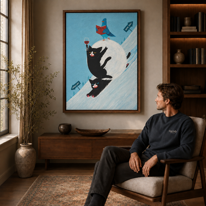 Man seated in an armchair beside a walnut floating-frame wall art of a grumpy calico cat in a blue dress.