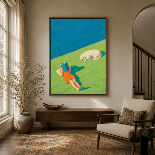 Bold aerial-view reading and dog canvas print hung in a bright entryway with arched doorway and staircase
