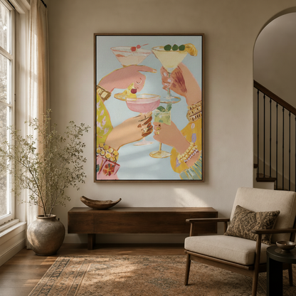Framed cocktail painting print hanging in modern entryway with dried botanicals and arched doorway