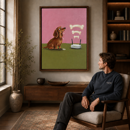 Man seated in an armchair gazing at framed dachshund canvas wall art above a wooden sideboard.