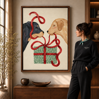 Two dogs lean nose to nose over a green present wrapped with a flowing red ribbon.