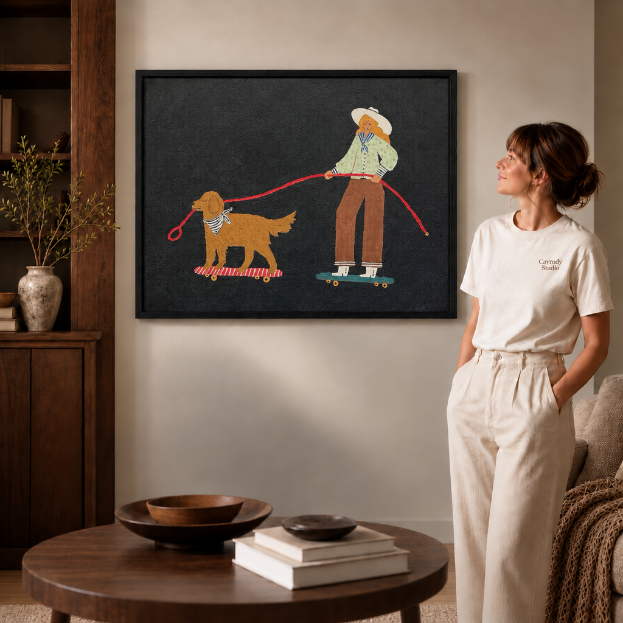 a black-framed whimsical canvas of a cowgirl and her dog on skateboards.