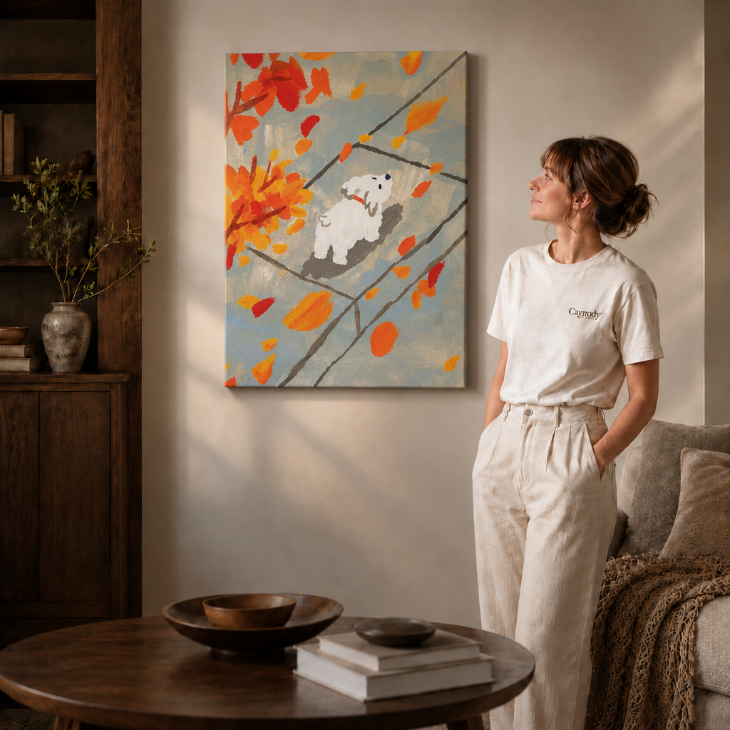 Woman in a cream outfit beside a gallery-wrapped autumn puppy wall art canvas, soft daylight in a cozy living room.